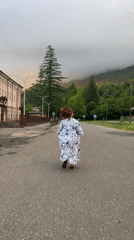 Movement and vehicles on a quiet mountain road, day to night