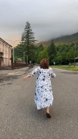 Movement and vehicles on a quiet mountain road, day to night