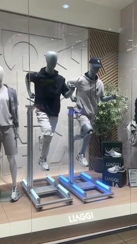 Athletic mannequins displayed in dynamic poses at Pleven store