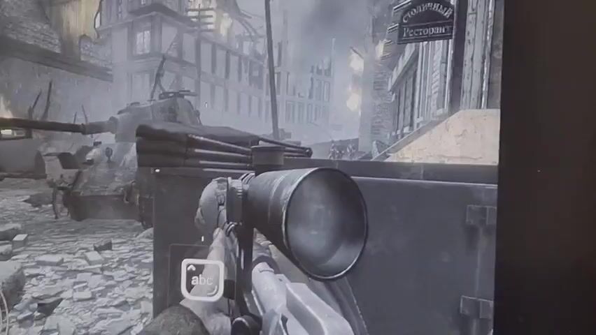 This video captures a first-person perspective within a video game, likely a World War II-era shooter. The scene opens with a view from the scope of a rifle, showing a desolate urban environment with destroyed buildings and what appears to be a tank in the background. The visual style is monochromatic, giving it a grim, historical feel. As the view shifts, enemies are spotted. Initially, a single enemy soldier is visible, then the scope focuses on a group of soldiers advancing. The game's user interface is partially visible, with an "abc" button icon and prompts like "Hold shift to steady." The video briefly shows a close-up of a different angle, revealing more of the game's graphics and gameplay elements before returning to the scope view of the advancing enemy soldiers. The overall impression is one of intense combat in a war-torn city.