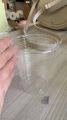 Rome resident handles measuring cup, cat spotted nearby