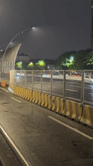 Rainy night pedestrian activity observed in Shanghai's Yangpu District
