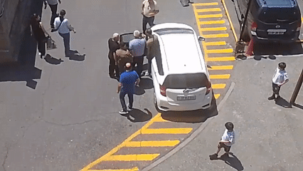 Activity around parked vehicles in an outdoor lot