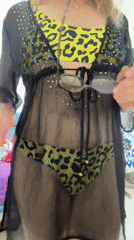 Woman models swimwear during indoor photo session in Ramat Gan