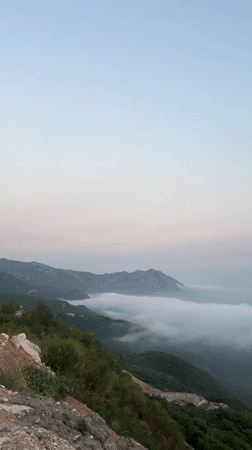Dense fog blankets Lapčići's coastal valleys at dusk
