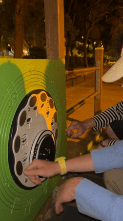 Barcelona street vendors, playground musicians documented Sunday afternoon