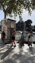 Street music and foot traffic fill central Barcelona on a sunny afternoon