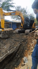 SANY excavator digging a trench at a Karawang work site