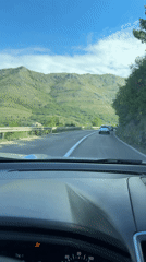 Vehicle travels winding mountain road in Montenegro