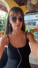Earbuds in, sunglasses on — a moment in North Kuta