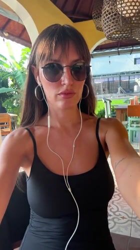 Earbuds in, sunglasses on — a moment in North Kuta