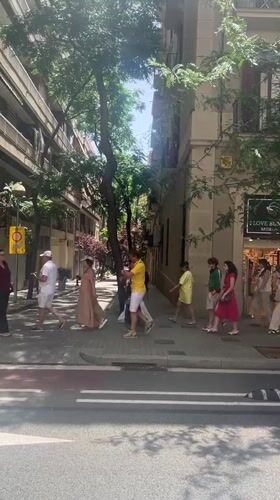 Sidewalk life outside a Barcelona art gallery