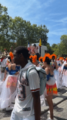 Carnival parade with costumed dancers and brass band, Paris