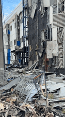 Building damage and debris documented in Kyiv street