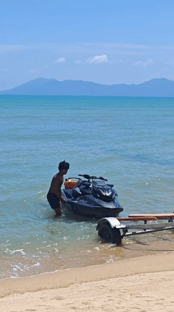 Jet ski loaded onto trailer on Ko Samui beach