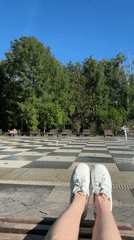 Person sits by decorative fountain in Kazan