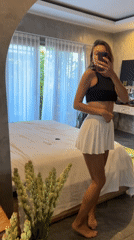Woman documents morning activities in North Kuta bedroom