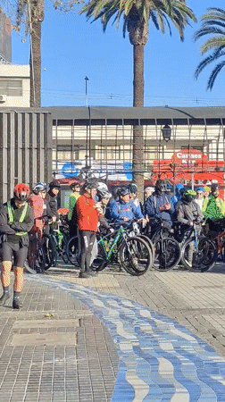 Large cycling group poses for a photo in Puente Alto