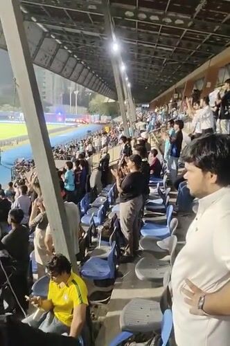 Soccer fans celebrate at Mumbai stadium during evening match