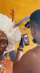 Artist creates portraits in Nigerian studio using phone references