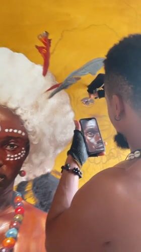 Artist creates portraits in Nigerian studio using phone references