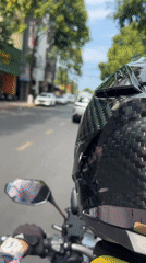 Motorcycle rider takes morning coffee break in Nha Trang