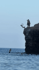 Cliff jumping into the Adriatic near Budva on a clear day