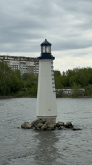 White lighthouse spotted on rock island in Krasnoyarsk river