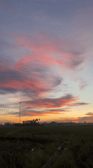 Vivid sunset colors paint the sky over Dayah Baroh, Indonesia
