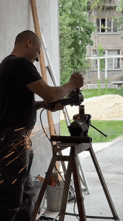 Worker grinds metal pipe in Kazanlak workshop