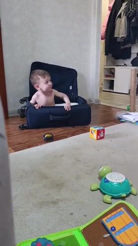 Toddler found sitting in suitcase, smiling in Ufa home