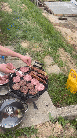 Backyard BBQ documented at wooden cabin in rural Bulgaria