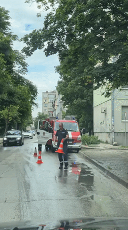 Firefighters clear fallen tree branch from wet Plovdiv street