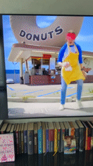TV clip shows dancing outside a donut shop in Ukraine