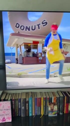 TV clip shows dancing outside a donut shop in Ukraine