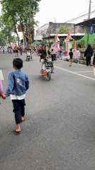 Street festival with market stalls and stage in Purwodadi