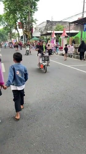 Street festival with market stalls and stage in Purwodadi