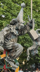 Moscow park scenes captured: clown fountain, street drummer performance