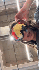 Woman tries on eyewear at Krasnoyarsk extreme sports store