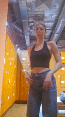Woman Takes Multiple Mirror Selfies During Gym Session