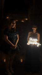 Birthday celebration captured in dimly lit Varna setting