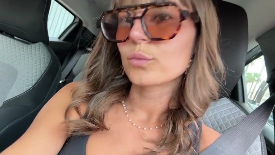 Woman in tortoise shell sunglasses observed in car in Cannes