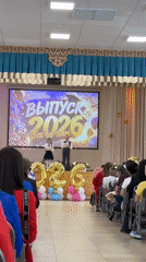 Children and women participate in formal school ceremony