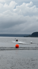 Jet ski racing on an Izhevsk lake under overcast skies