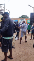 Street activity documented near commercial phone shops
