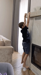 Boy hangs from fireplace mantel in Chaikovsky home