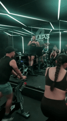 Early morning spin class held in neon-lit Puebla studio