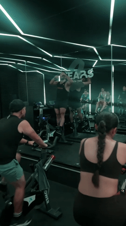 Early morning spin class held in neon-lit Puebla studio
