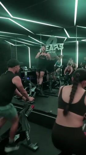 Early morning spin class held in neon-lit Puebla studio