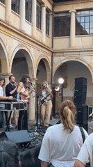 Live music fills a historic Oviedo courtyard on a summer evening.